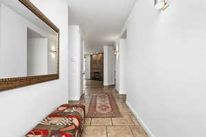Hallway featuring baseboards