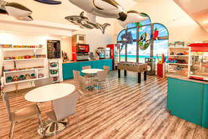 Game room with lofted ceiling