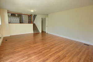 Unfurnished room featuring light wood-type flooring