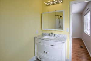 Bathroom featuring vanity and light wood-style flooring