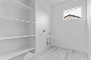 Laundry room with washer hookup and electric dryer hookup