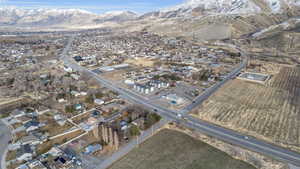 View of property location featuring nearby suburban area and a mountainous background