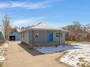 View of front of home with a detached garage