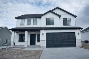 View of front of home featuring an attached garage, a porch, concrete driveway, and a shingled roof