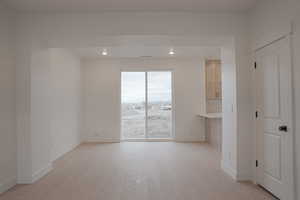 Spare room featuring light wood-style floors and recessed lighting