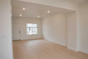 Unfurnished room featuring light wood-type flooring and recessed lighting