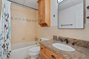 Bathroom off kitchen area featuring tub.
