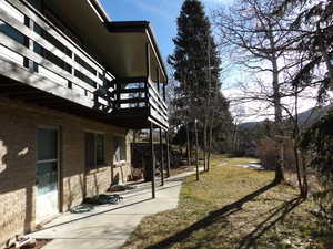 View of green lawn with a balcony