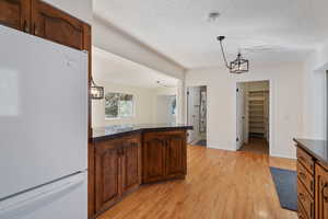 Kitchen looking toward 3/4 bathroom and walk-in pantry