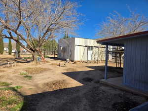 View of yard with a workshop