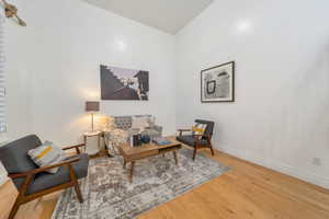 Sitting room with light wood-style flooring and baseboards