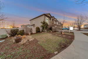 View of property exterior at dusk