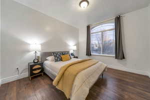 Bedroom featuring dark wood-type flooring