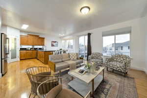 Living room with light wood finished floors and a textured ceiling