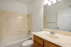 Bathroom featuring bathtub / shower combination and vanity