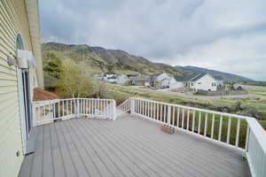 Deck featuring a mountain view and a residential view
