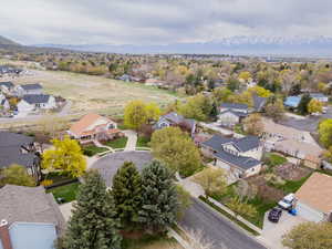 Aerial view of residential area featuring mountains