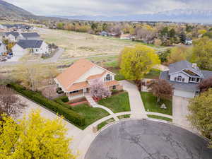 Aerial view of residential area featuring a mountainous background