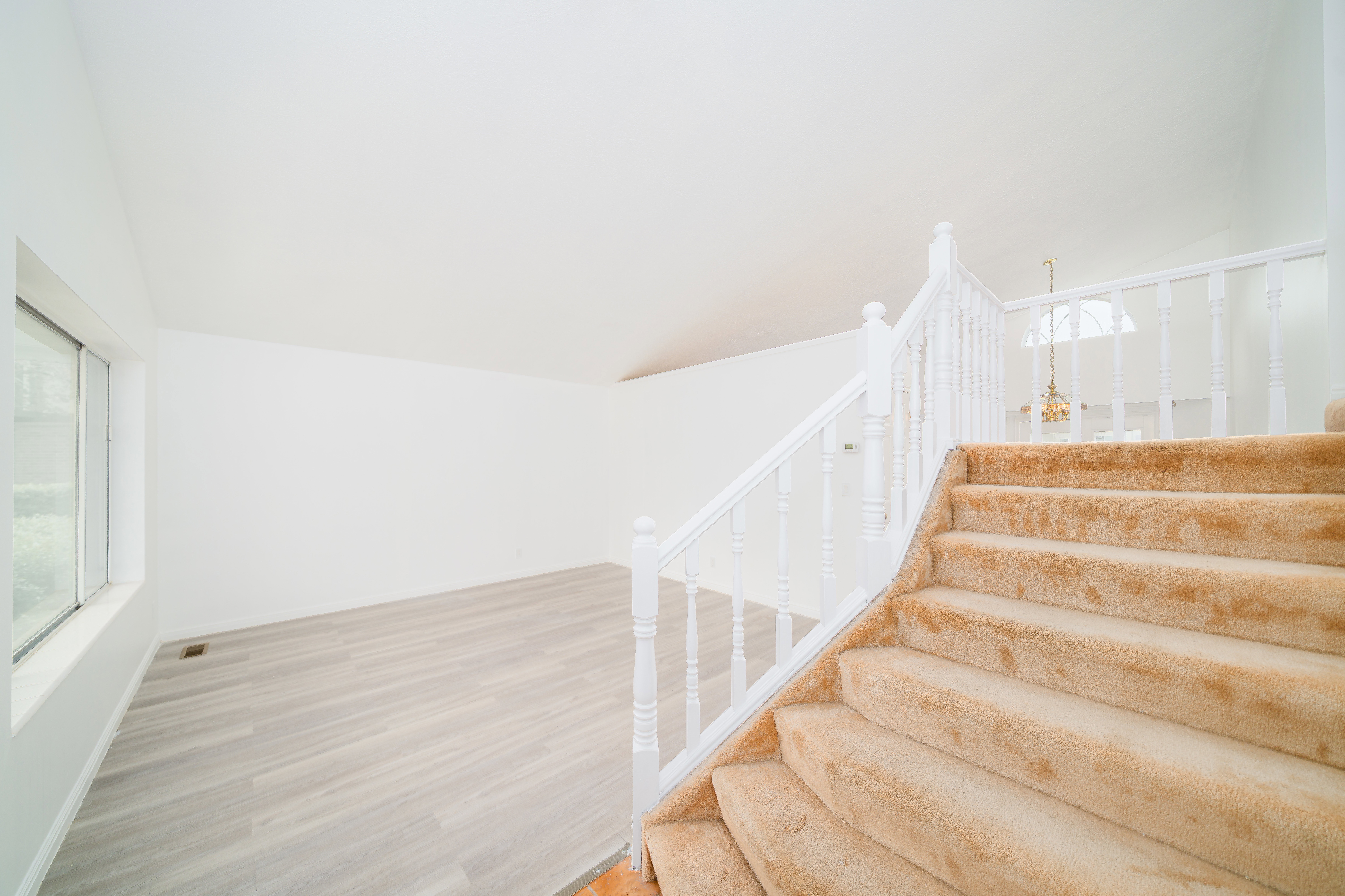 Staircase featuring wood finished floors