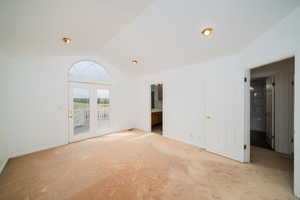Carpeted spare room with baseboards