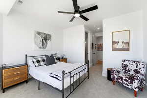 Bedroom featuring light carpet, a ceiling fan, and recessed lighting