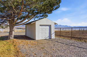 View of outdoor structure with a mountain view and a view of rural / pastoral area