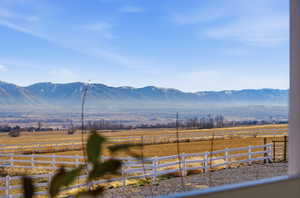 View of mountain background featuring rural landscape