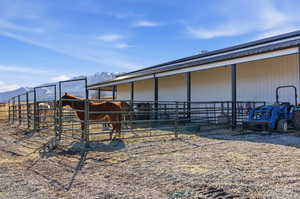 Horse barn featuring a mountain view