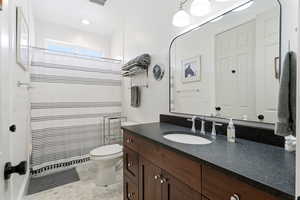 Bathroom with vanity and a shower with shower curtain
