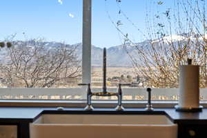 Kitchen view of mountains and dark countertops