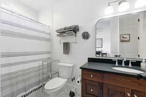 Full bath with vanity and curtained shower