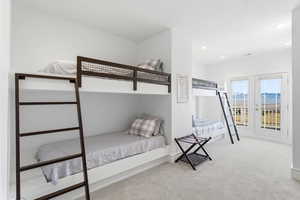 Bedroom featuring carpet flooring, a mountain view, french doors, and recessed lighting