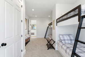 Bedroom featuring recessed lighting and light carpet