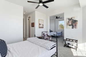 Bedroom with light carpet and ceiling fan