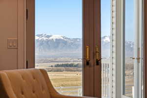 Doorway to outside featuring a mountain view and french doors