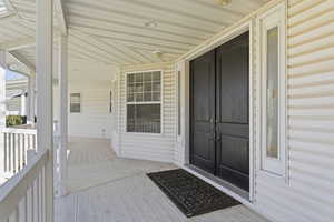 Property entrance with a deck