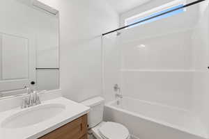 Full bath featuring bathing tub / shower combination and vanity