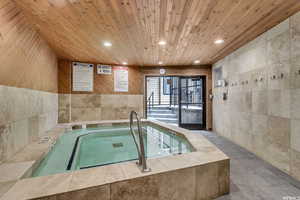 View of pool with an in-ground hot tub and a pool
