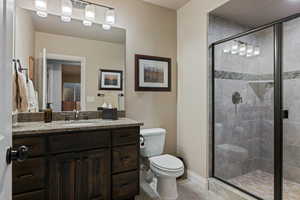 Bathroom featuring vanity and a stall shower