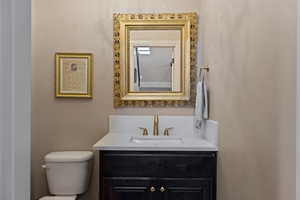 Half bath with vanity and toilet