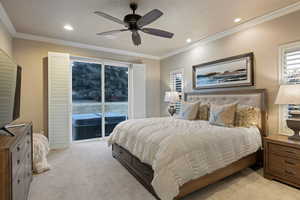Bedroom featuring access to exterior, light carpet, crown molding, a ceiling fan, and recessed lighting