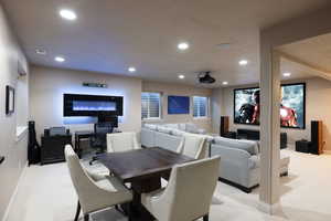 Home theater room featuring light carpet and recessed lighting