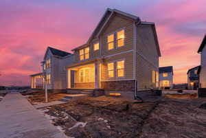 View of front of home featuring brick siding