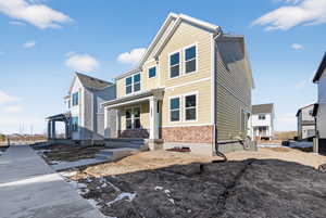 View of front of house with covered porch