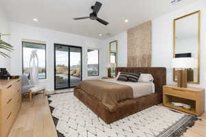 Bedroom with light wood finished floors, access to exterior, a ceiling fan, and recessed lighting