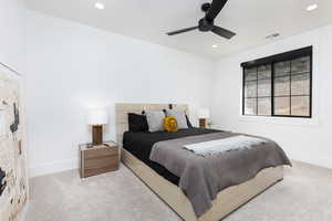 Carpeted bedroom with ceiling fan and recessed lighting