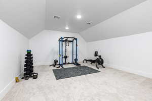 Workout area with carpet floors and baseboards