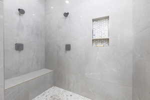 Bathroom featuring tiled shower