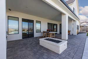View of patio / terrace featuring an outdoor fire pit and outdoor dining space