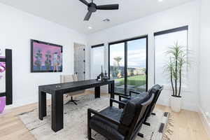 Office space featuring ceiling fan, light wood-style flooring, and recessed lighting